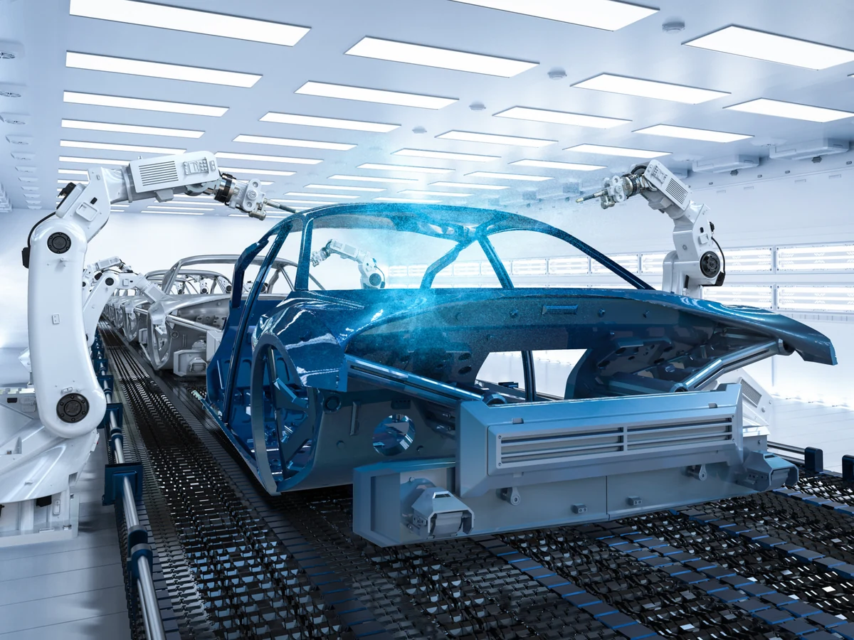 Robotic arms assembling a car body on an automotive production line
